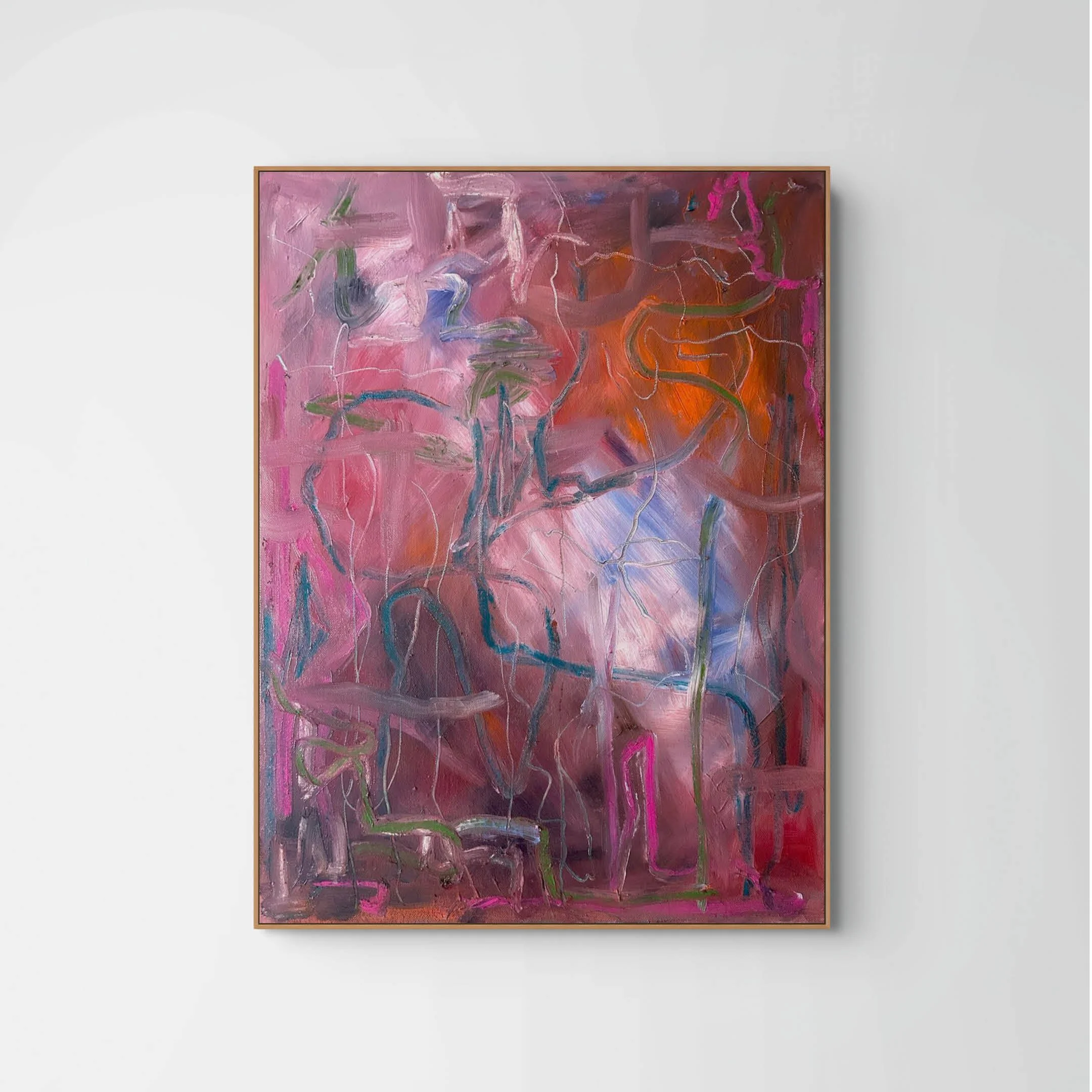 Abstract painting with pink, orange, purple, green, and blue brushstrokes on a large canvas, framed and displayed on a white wall.