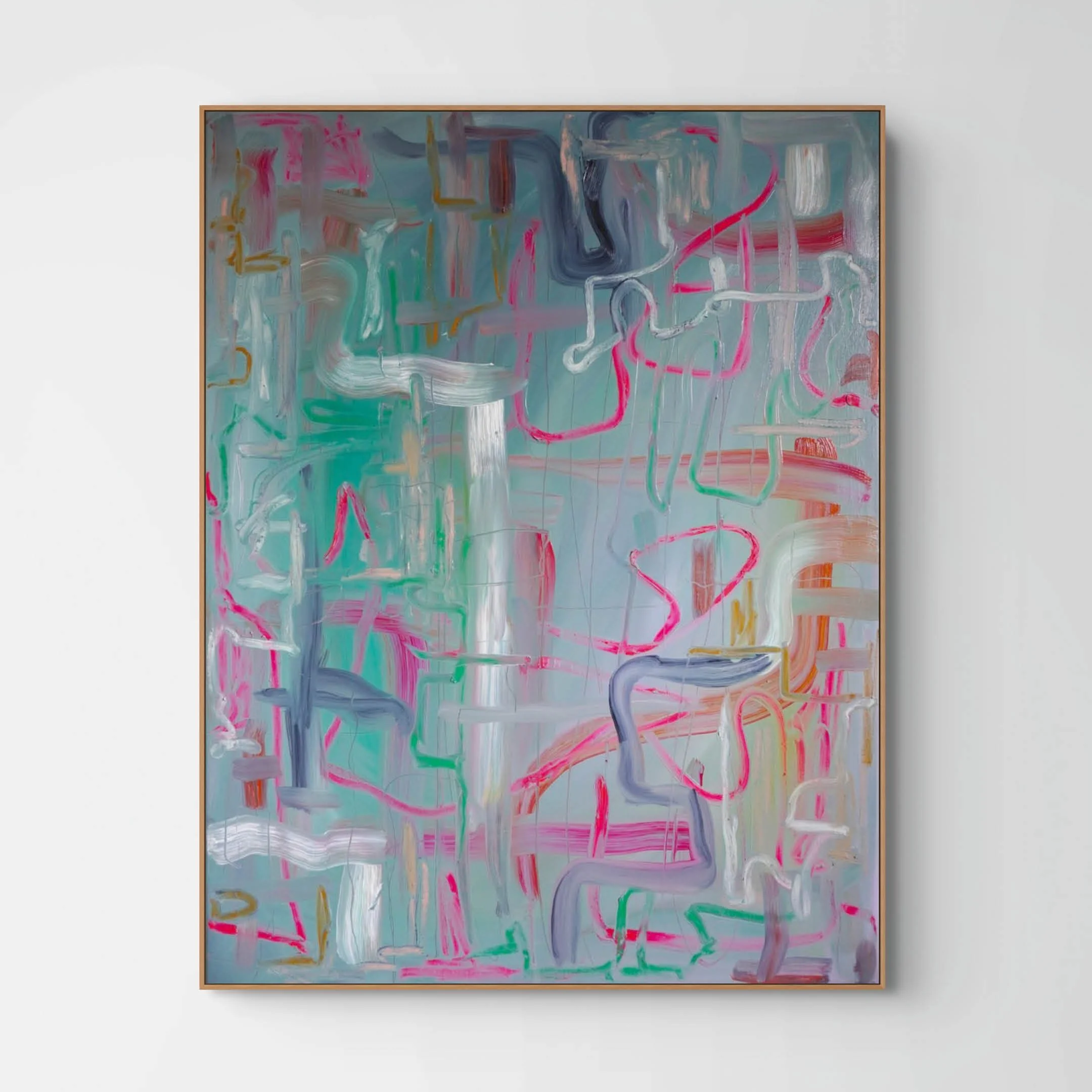 Abstract modern painting with colorful brushstrokes on a rectangular canvas framed in wood, hung on a white wall.