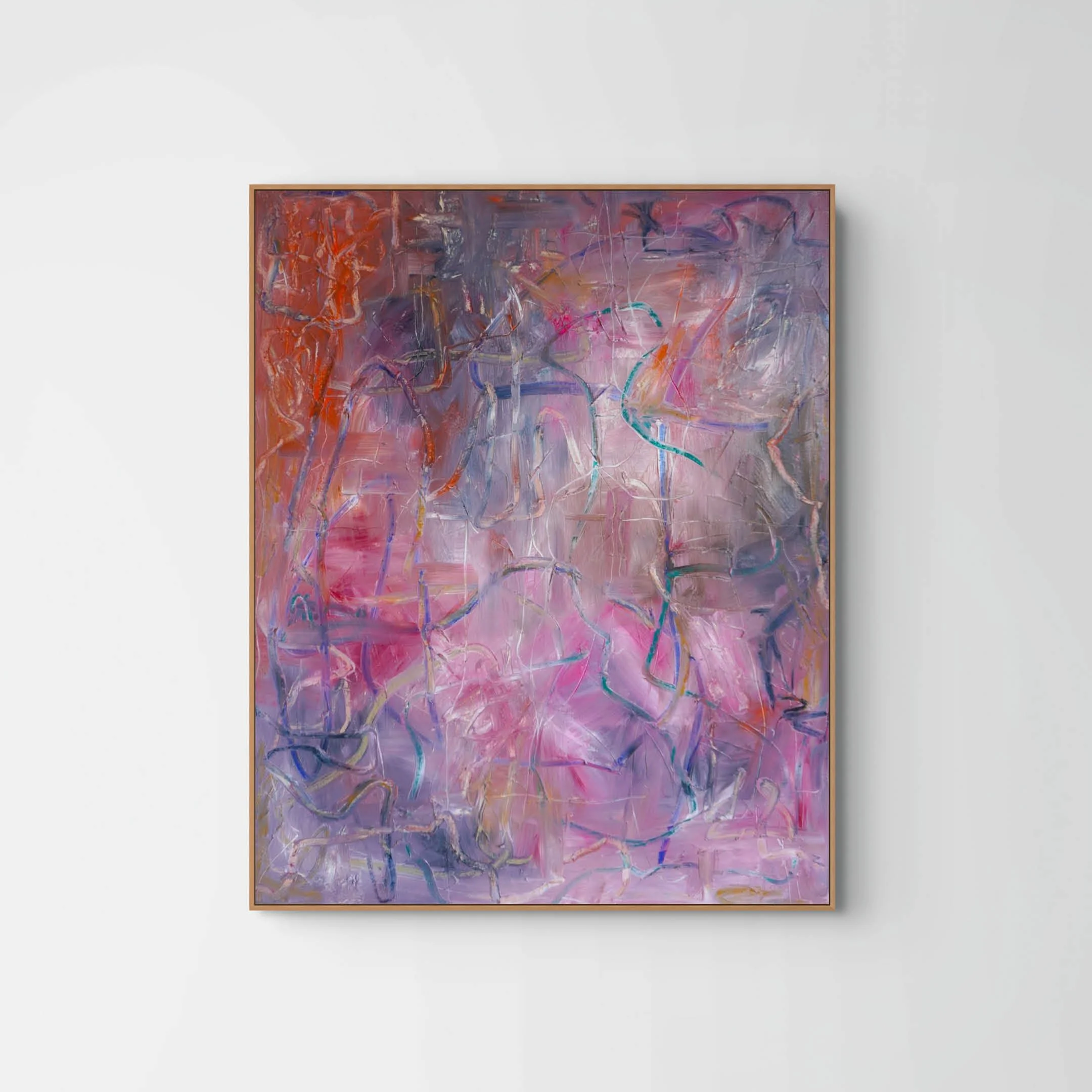 Abstract painting with swirling streaks of purple, pink, orange, and blue, framed in wood, hanging on a white wall.