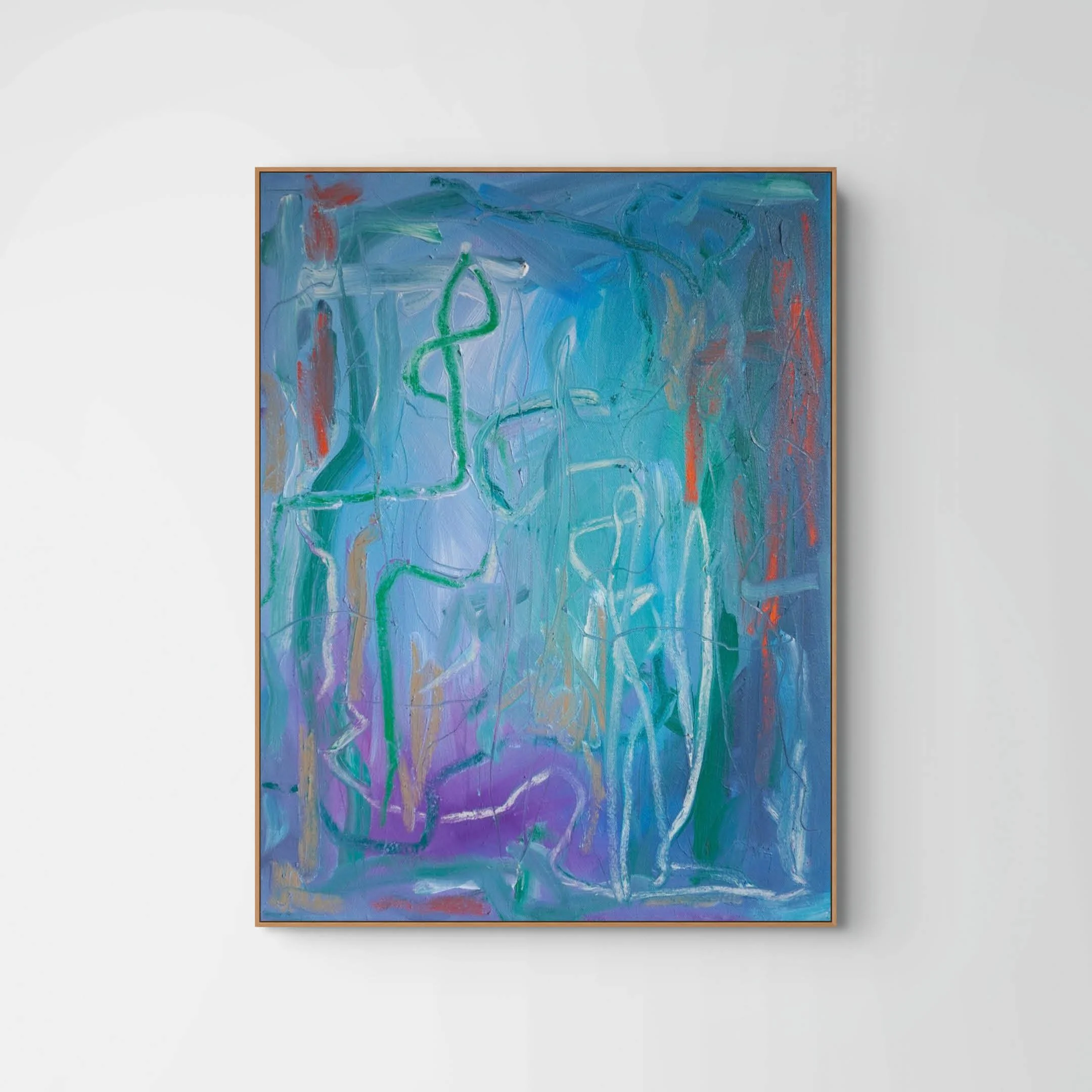 An abstract painting with blue, green, red, purple, and white swirling and streaking colors, framed with a simple wooden border, hung on a plain white wall.