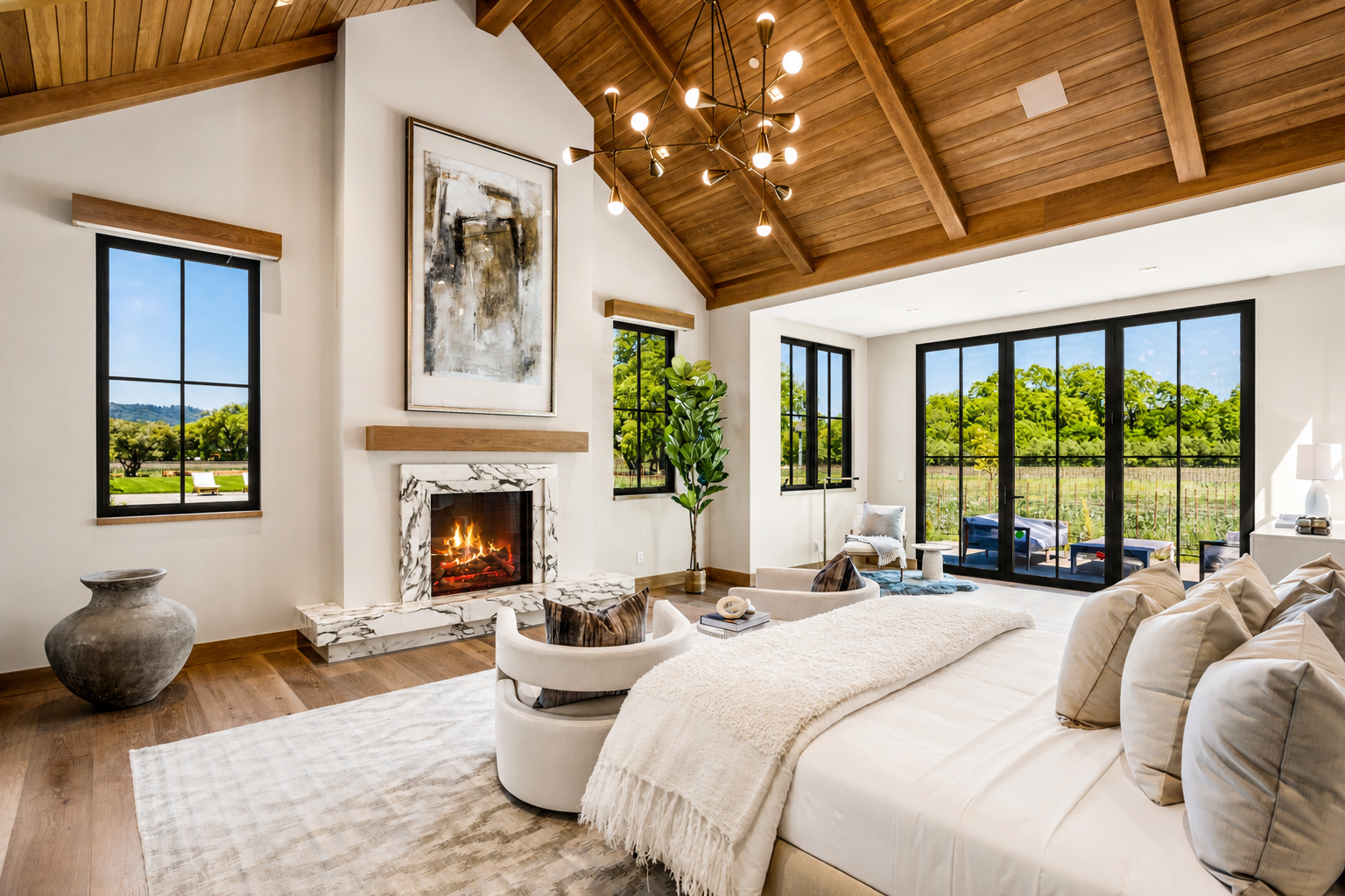 Bedroom at Trubody Ranch in Napa Valley featuring a marble fireplace, expansive sliding glass doors, a private patio, and views to the surrounding landscape.