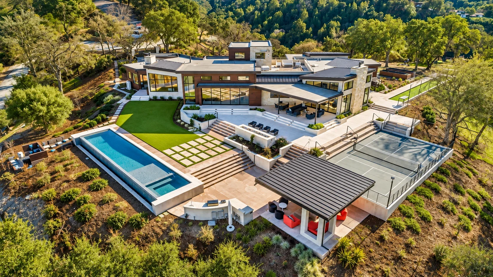 Aerial view of Gumtree in Los Gatos, featuring the modern custom residence, swimming pool, tennis courts, outdoor living areas, and landscaped grounds surrounded by mature trees.