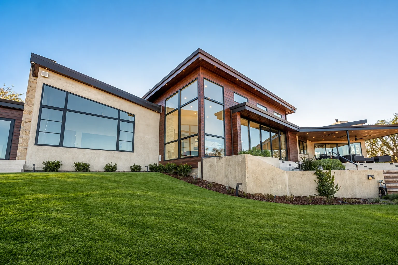 Exterior view of Gumtree in Los Gatos, featuring the multi-level modern residence, expansive glazing, and landscaped grounds.