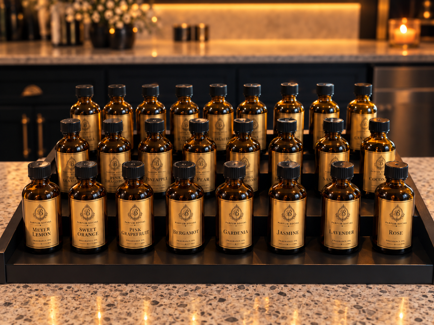 Display of various fragrance oils in amber glass bottles with black caps, arranged on a tray on a kitchen counter.