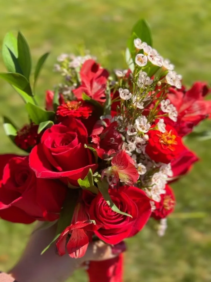 Red in full bloom. ❤️🌹

Designed to complement a bold red homecoming dress, this bouquet leans into rich reds and soft floral texture for a look that feels romantic, classic, and just a little wild.

The deep red blooms echo the dress without trying