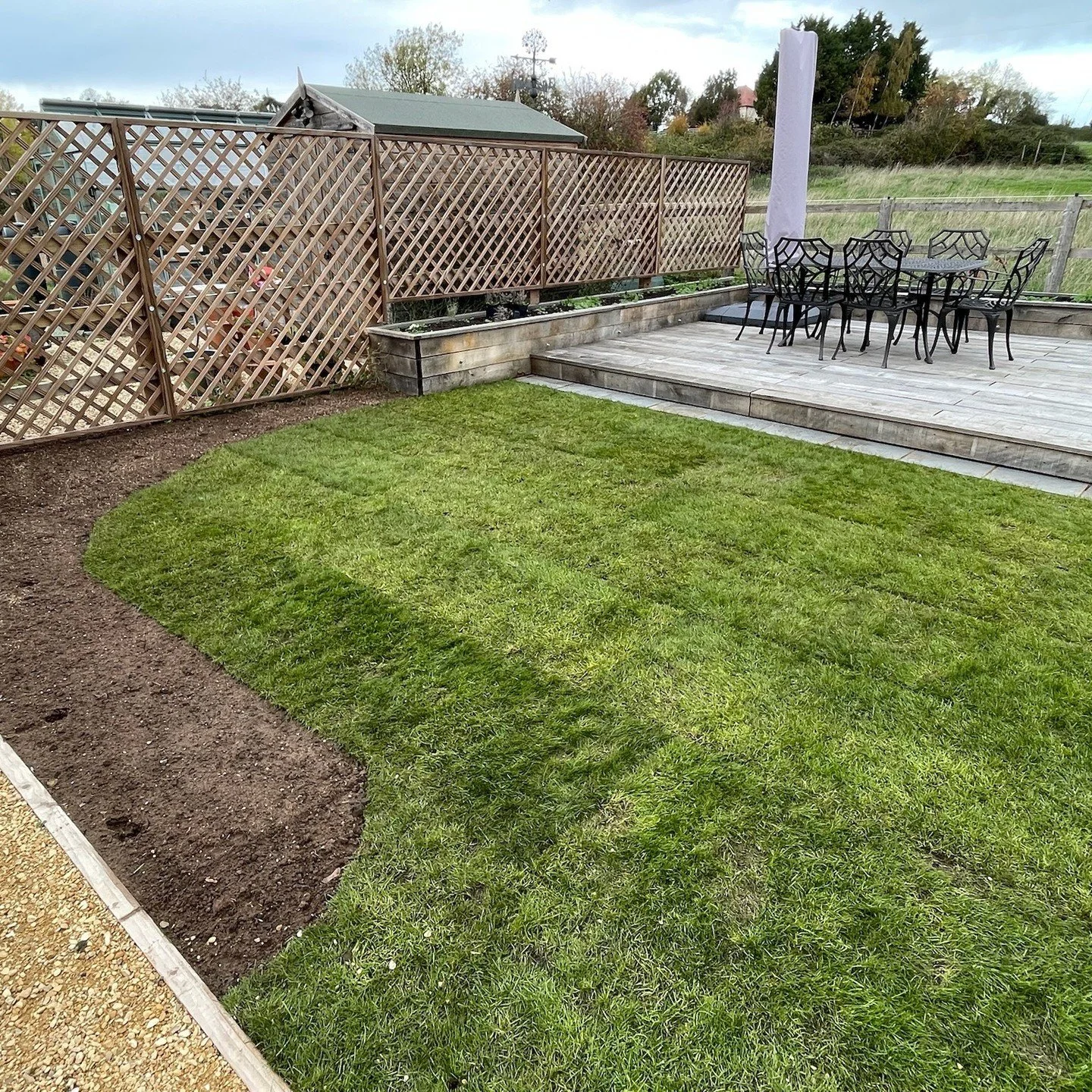Looking back at a deck and raised planters install from earlier this year. 

To give a rustic look and feel to the surface of the deck, 30mm fine sawn oak boards were used. To match the deck, the raised planters were made from 50mm sawn green oak wit