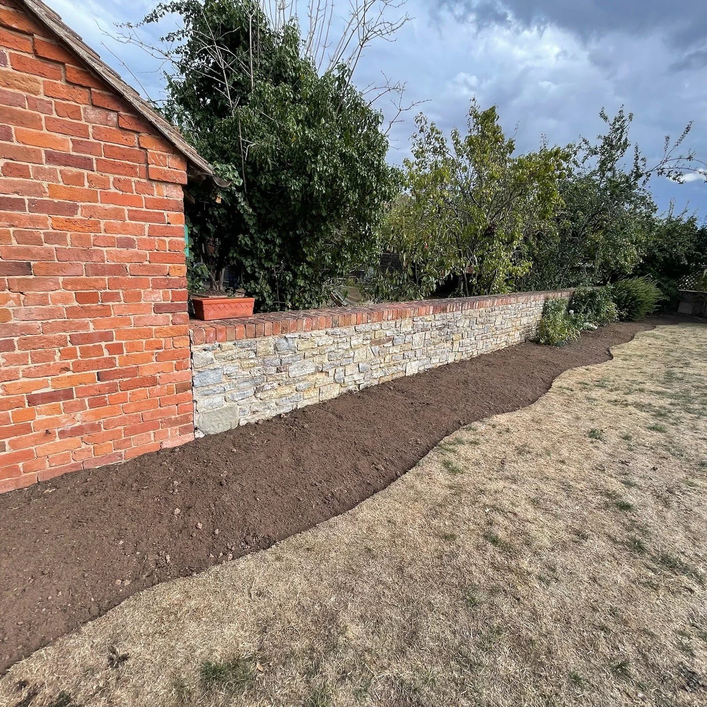 It was a pleasure to transform these garden borders to create more room for flowers to grow and thrive.

By connecting some existing planting areas and widening the border depth provides the customer with the space to layer different height plants, a