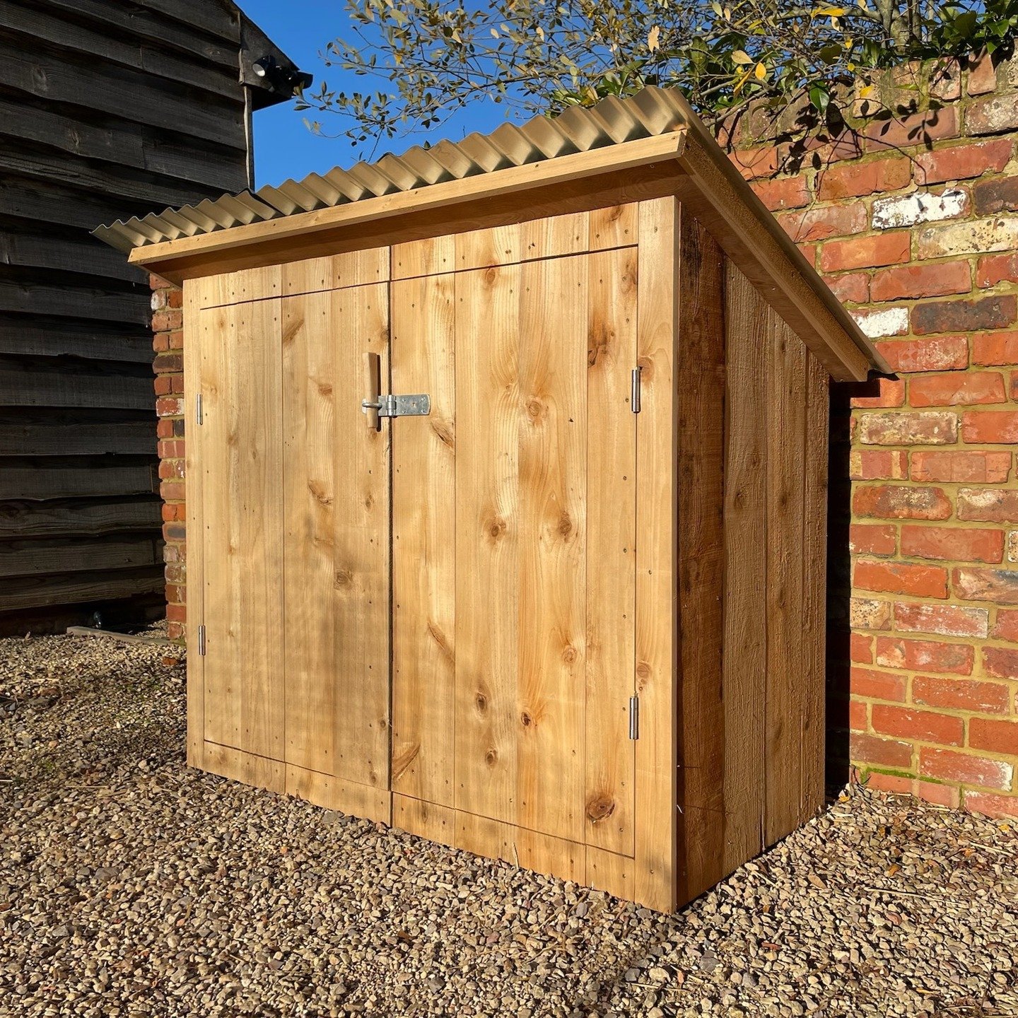 Heavy-duty outdoor storage cupboard, clad in Cedar, featuring galvanised Hasp &amp; Staple and stainless steel hinges.

Low profile galvanised corrugated roofing was used to provide balance, both proportionally and aesthetically.

The cedar has been 