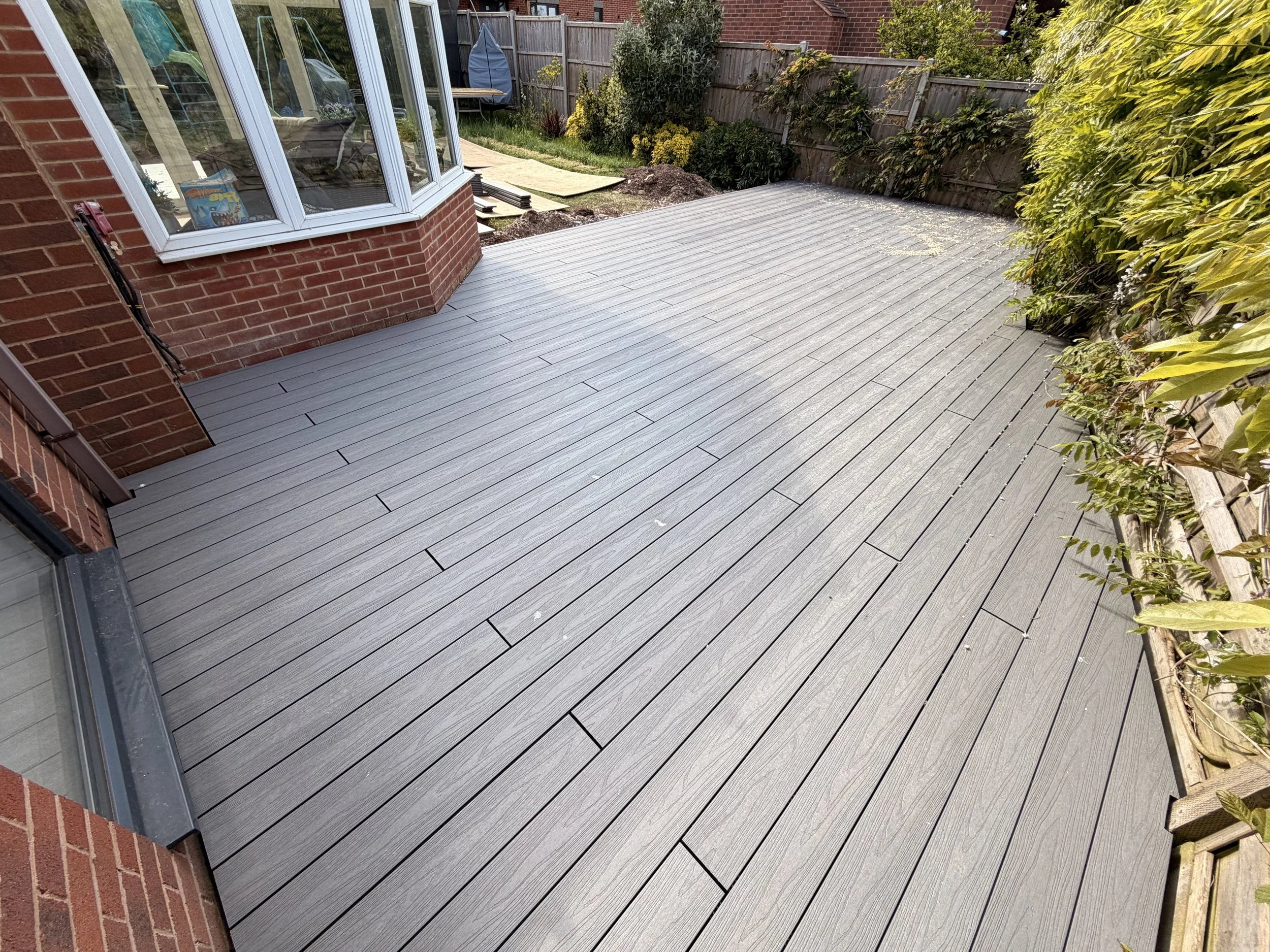 The finished deck - Dino premium composite decking in Pearl with matching bullnose edging.