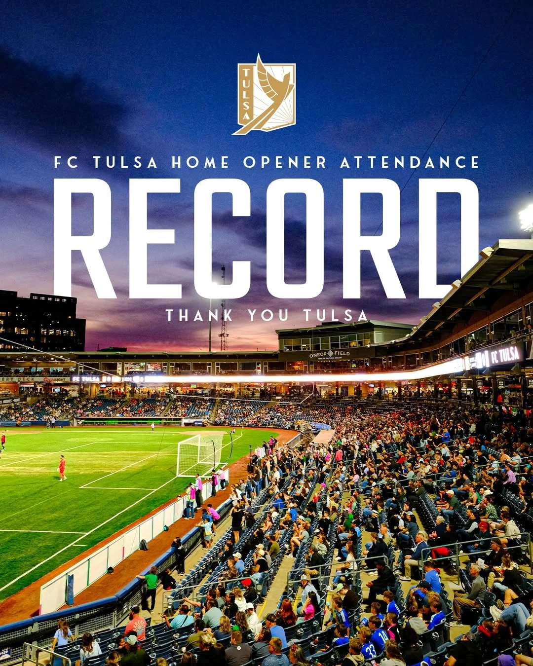 A crowded outdoor soccer stadium at sunset with a large crowd of spectators and a soccer field, celebrating FC Tulsa's home opener record attendance.