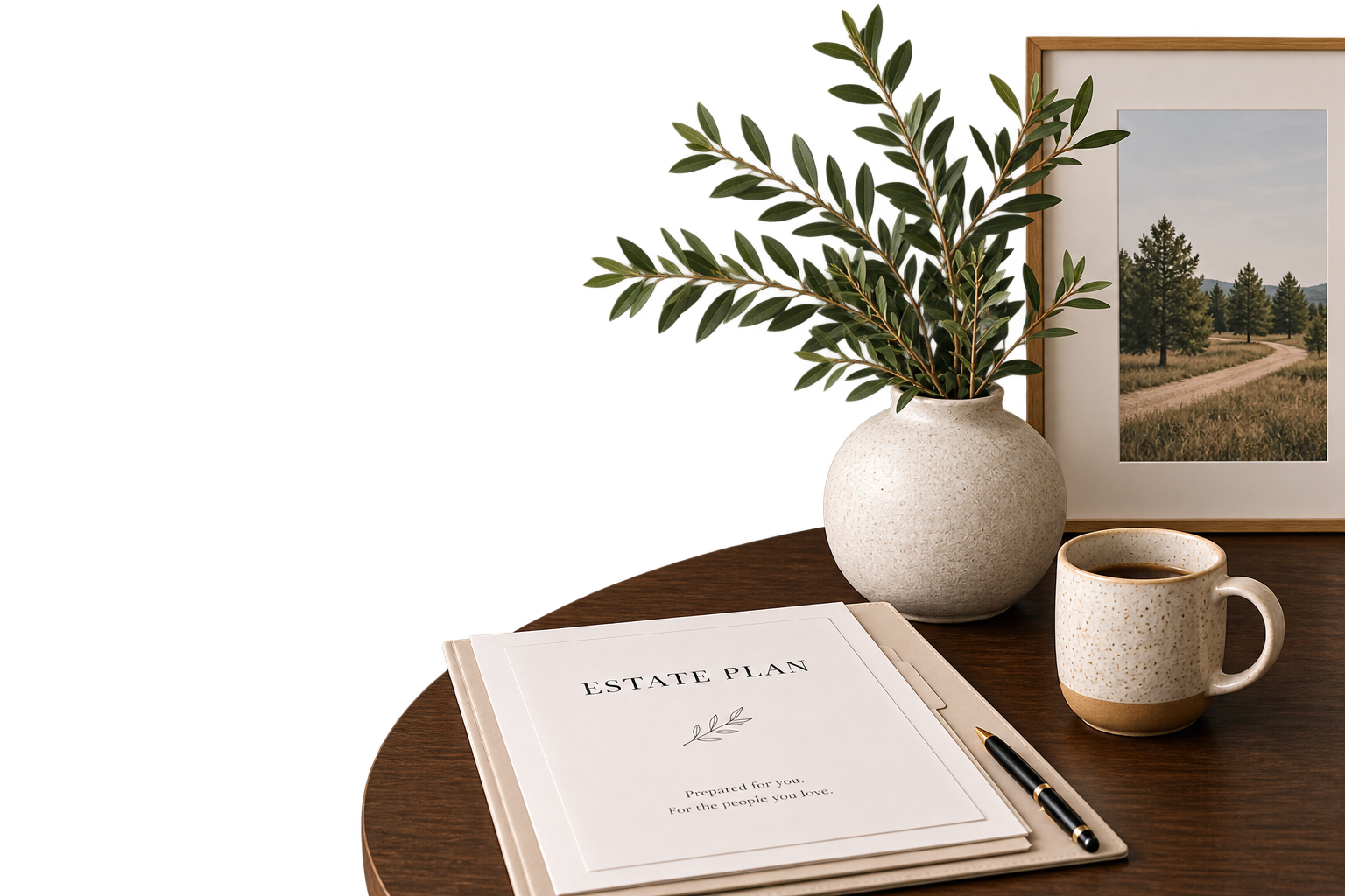 A round wooden table with a legal estate plan document, a pen, a coffee mug, a potted plant, and a framed landscape photograph