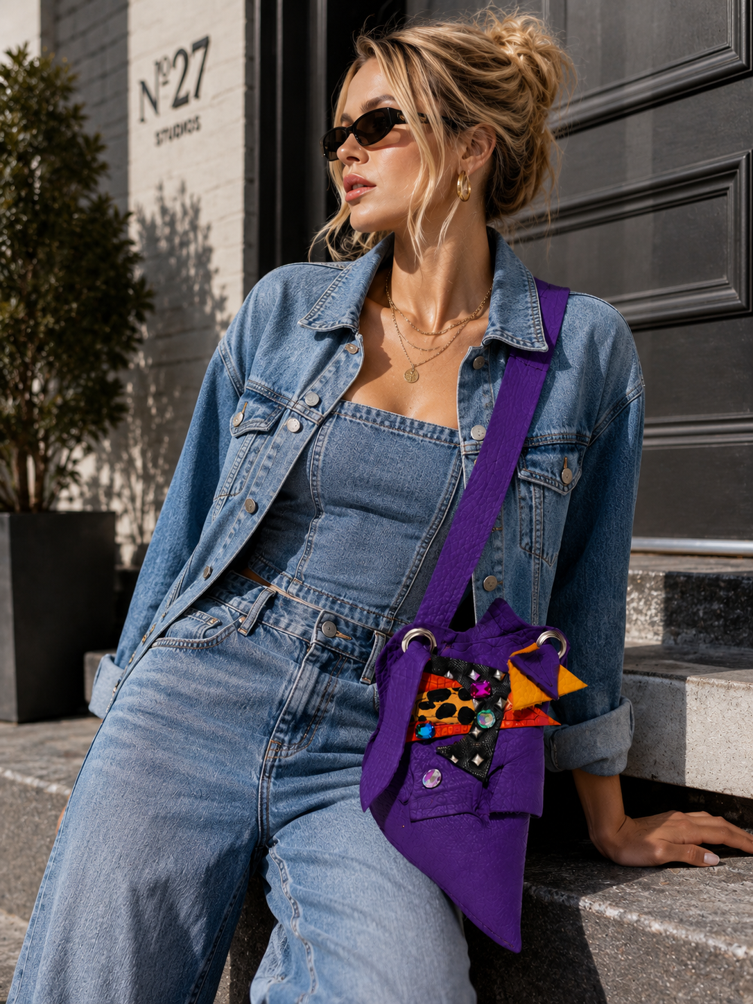 Model wearing the purple ZOLA Crossbody Bag