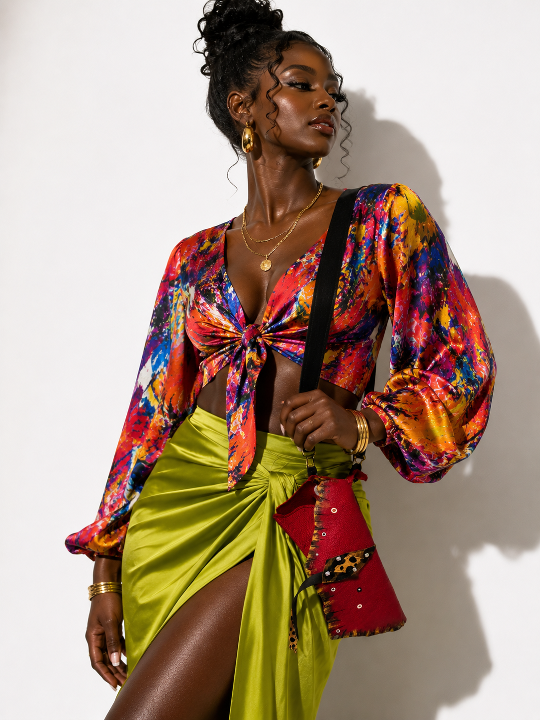 Model wearing the red KALI Crossbody Bag