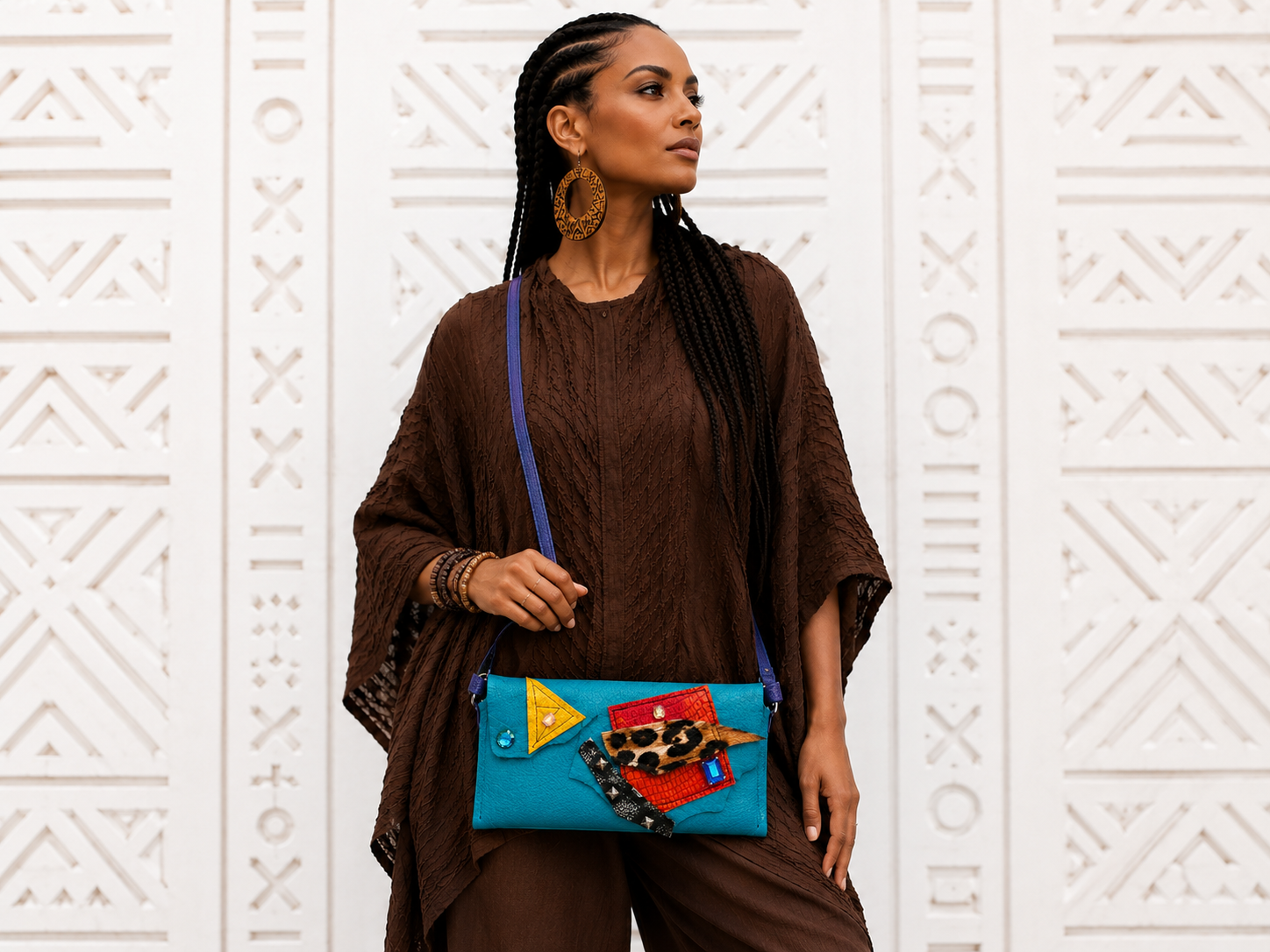 Model wearing the teal Zuri Crossbody Bag