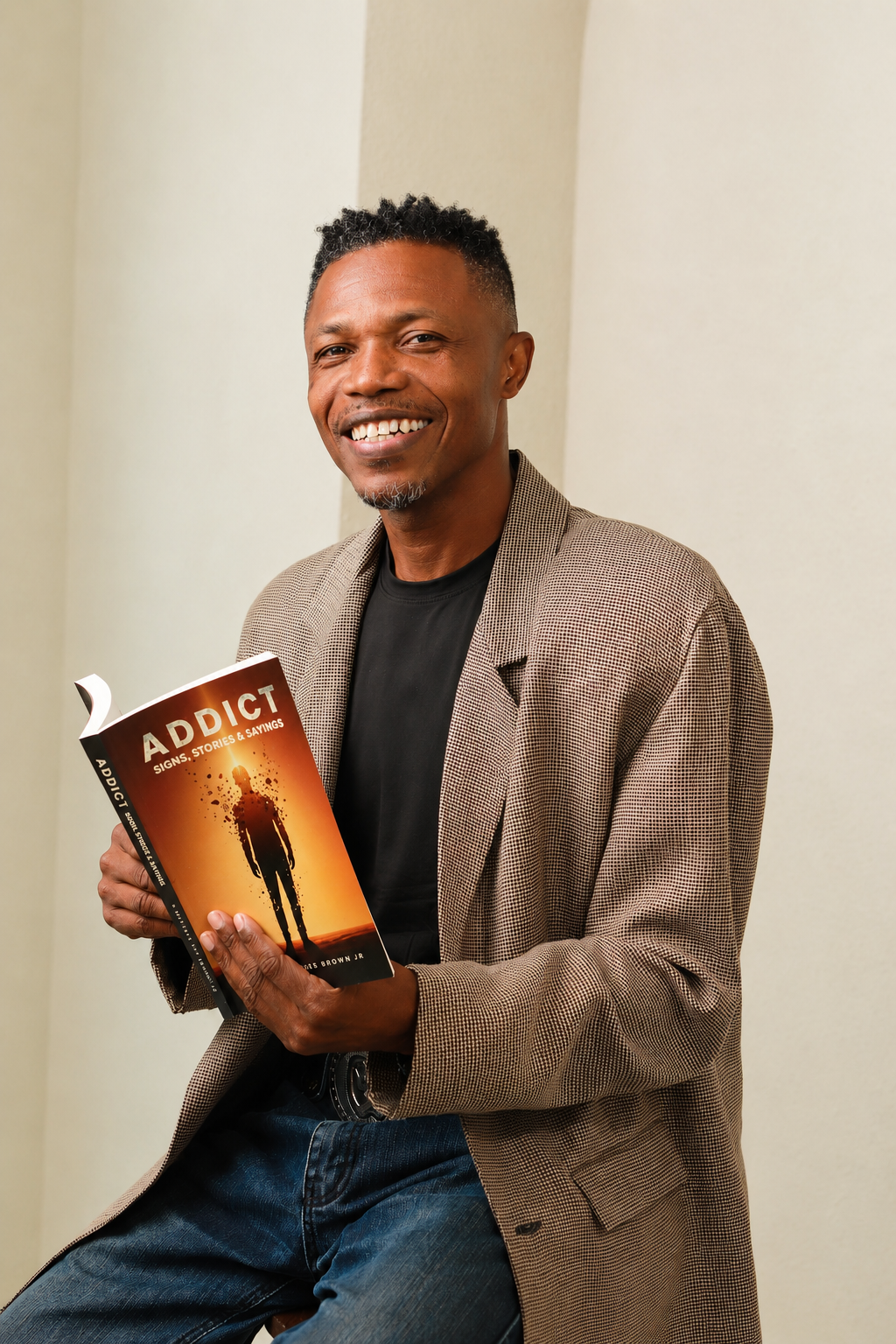 Author and speaker A. Mustafa Tut Brown Jr. speaking on stage about ADDICT: Signs, Stories & Sayings.