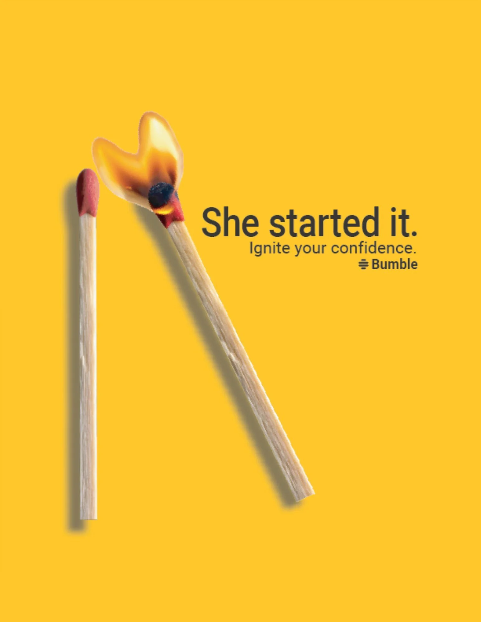 Bumble ad on a yellow background: a lit match touching an unlit match. Text reads "She started it. Ignite your confidence." Bumble logo. Copy and design by Mikayla Teet.