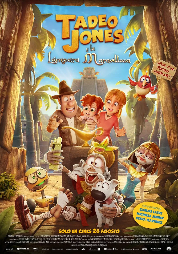 Animated movie poster for 'Tadeo Jones y la lámpara maravillosa' featuring a jungle setting with characters including a man in a hat, a woman, a young girl, a talking dog, a parrot holding a sign, and various animated creatures, with the background showing ancient ruins.