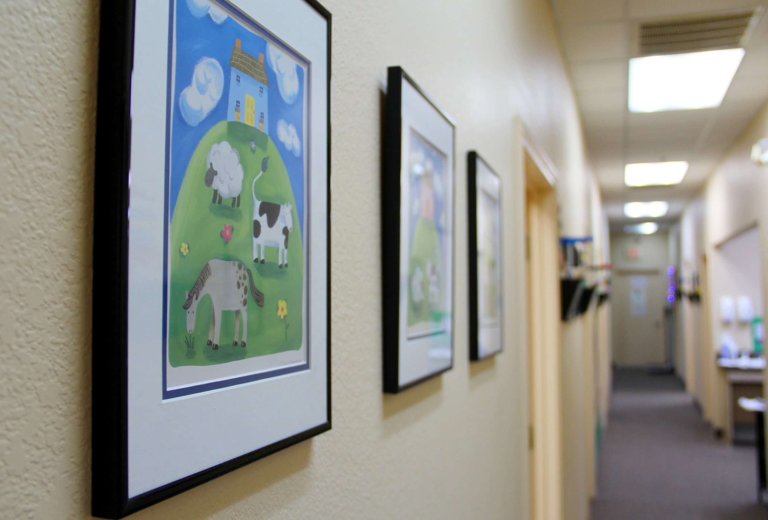 Photo of art frames on the wall at Carrollton Pediatrics.