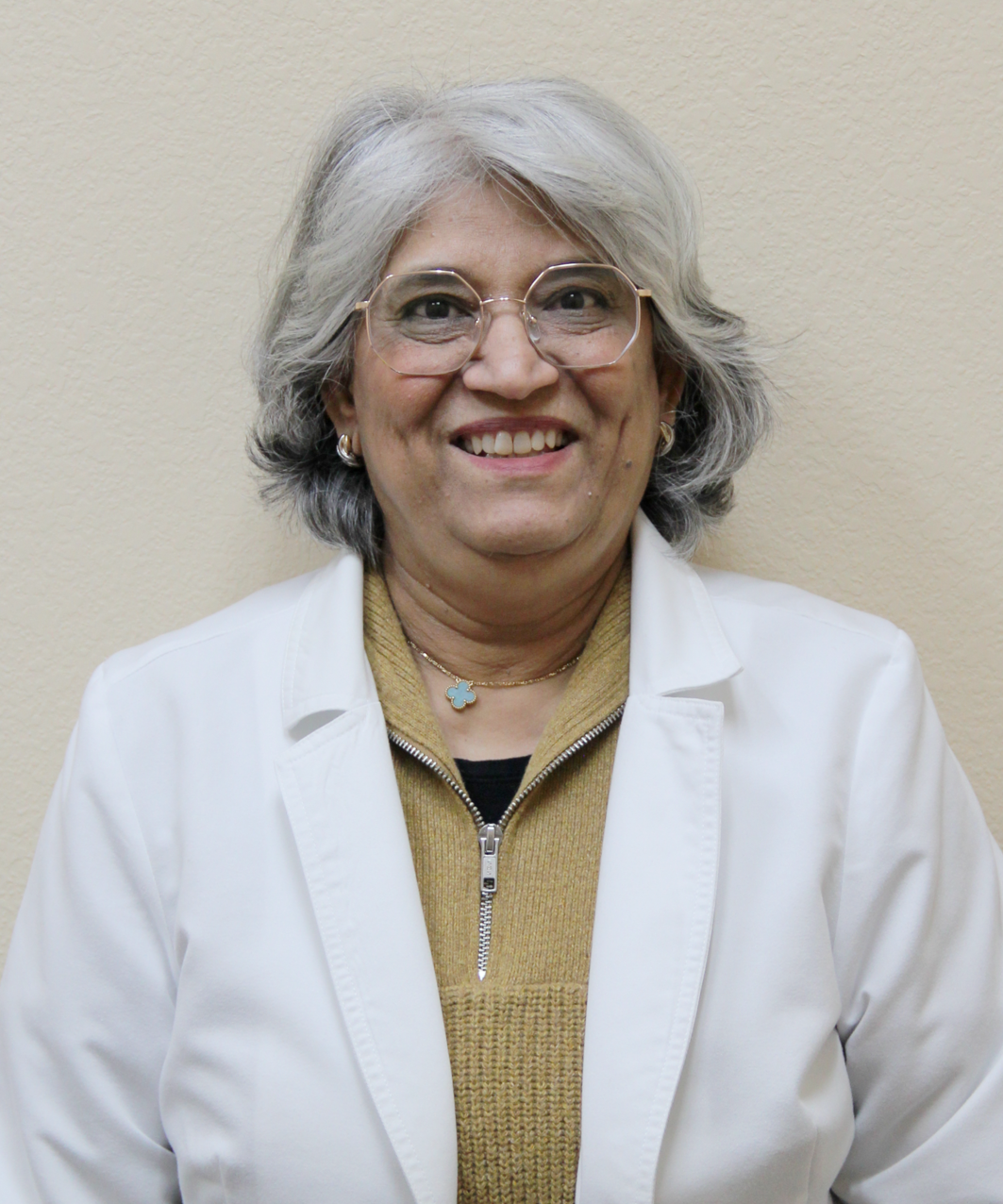 Professional headshot of Dr. Qamar Aslam at Carrollton Pediatrics