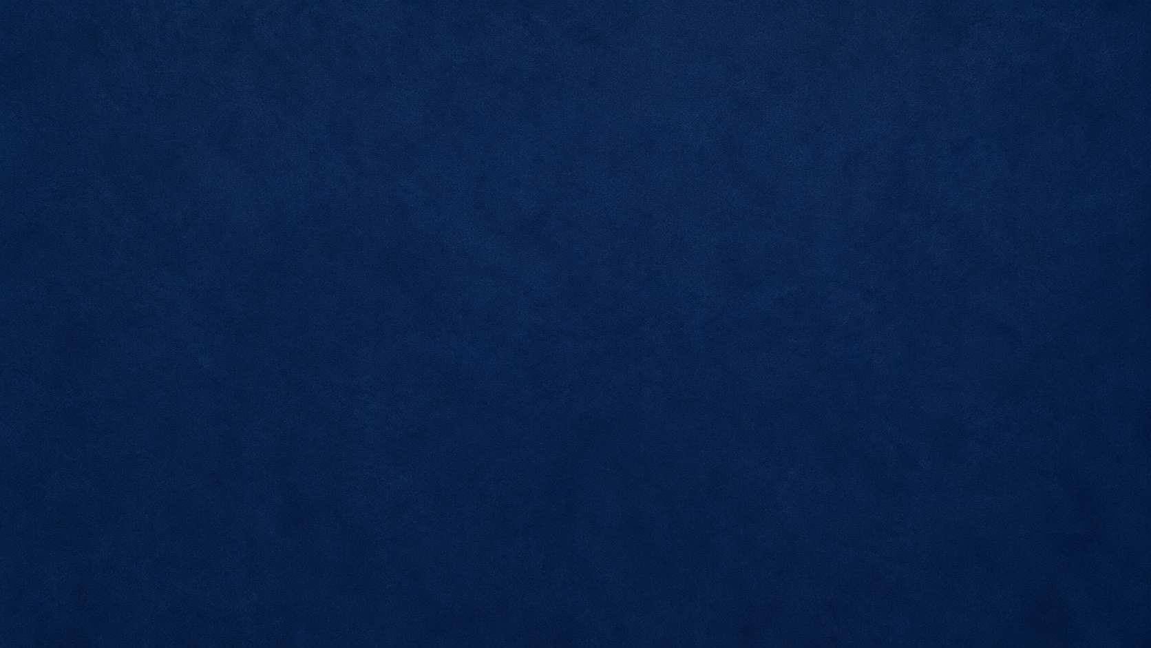 A solid, dark blue background with no visible objects or features.