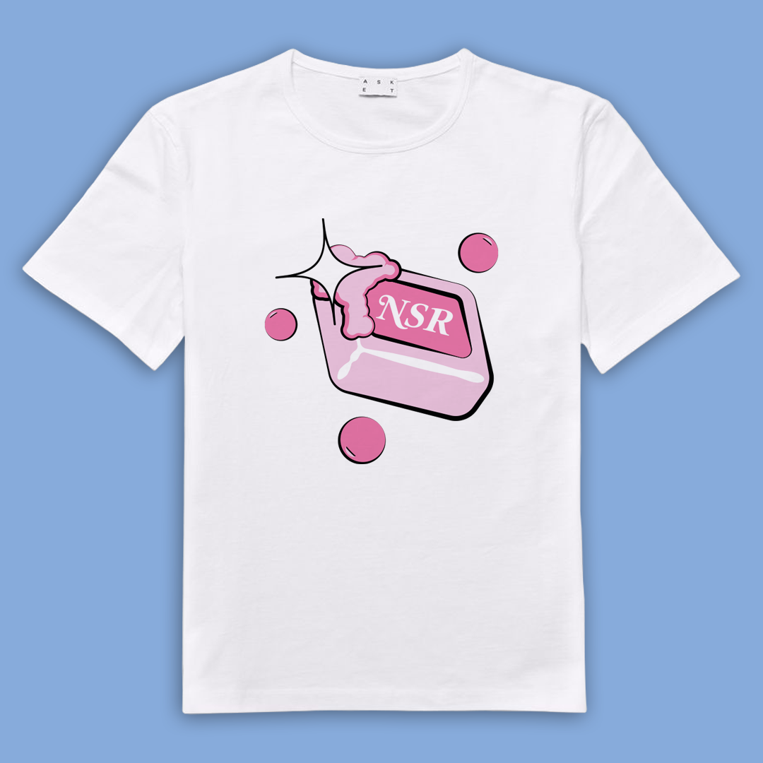 White t-shirt with a pink cartoon soap bar labeled NSR, with bubbles and sparkle effects.
