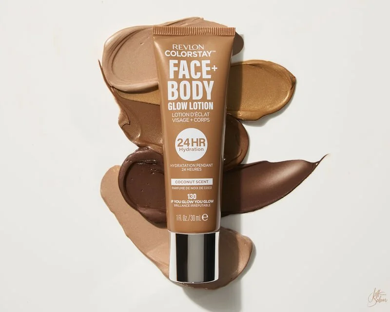 Tube of Revlon Colorstay Face + Body Glow Lotion with coconut scent, surrounded by swatches of different shades of foundation or lotion in various shades of beige and brown.
