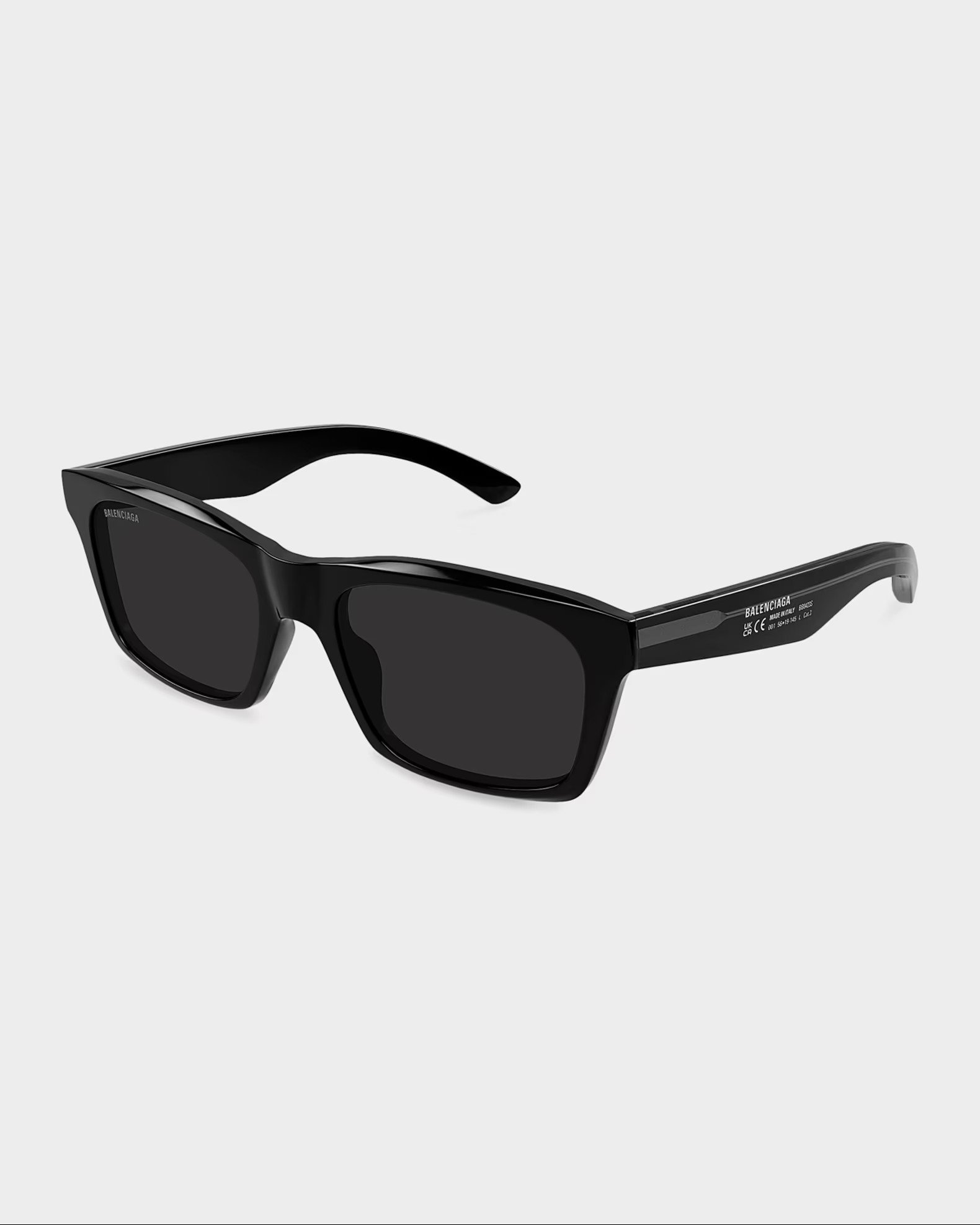 Black Balenciaga sunglasses with dark lenses and thick frames