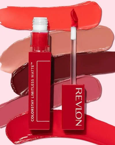 Revlon ColorStay lipstick with the cap removed, showing a lip gloss applicator and swatches of red, nude, and deep burgundy lipstick behind it.