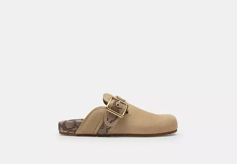 Beige Birkenstock slide sandal with gold buckle and patterned strap
