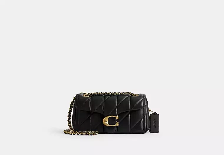 A small black quilted leather handbag with a gold chain strap and gold hardware, featuring a decorative gold clasp.