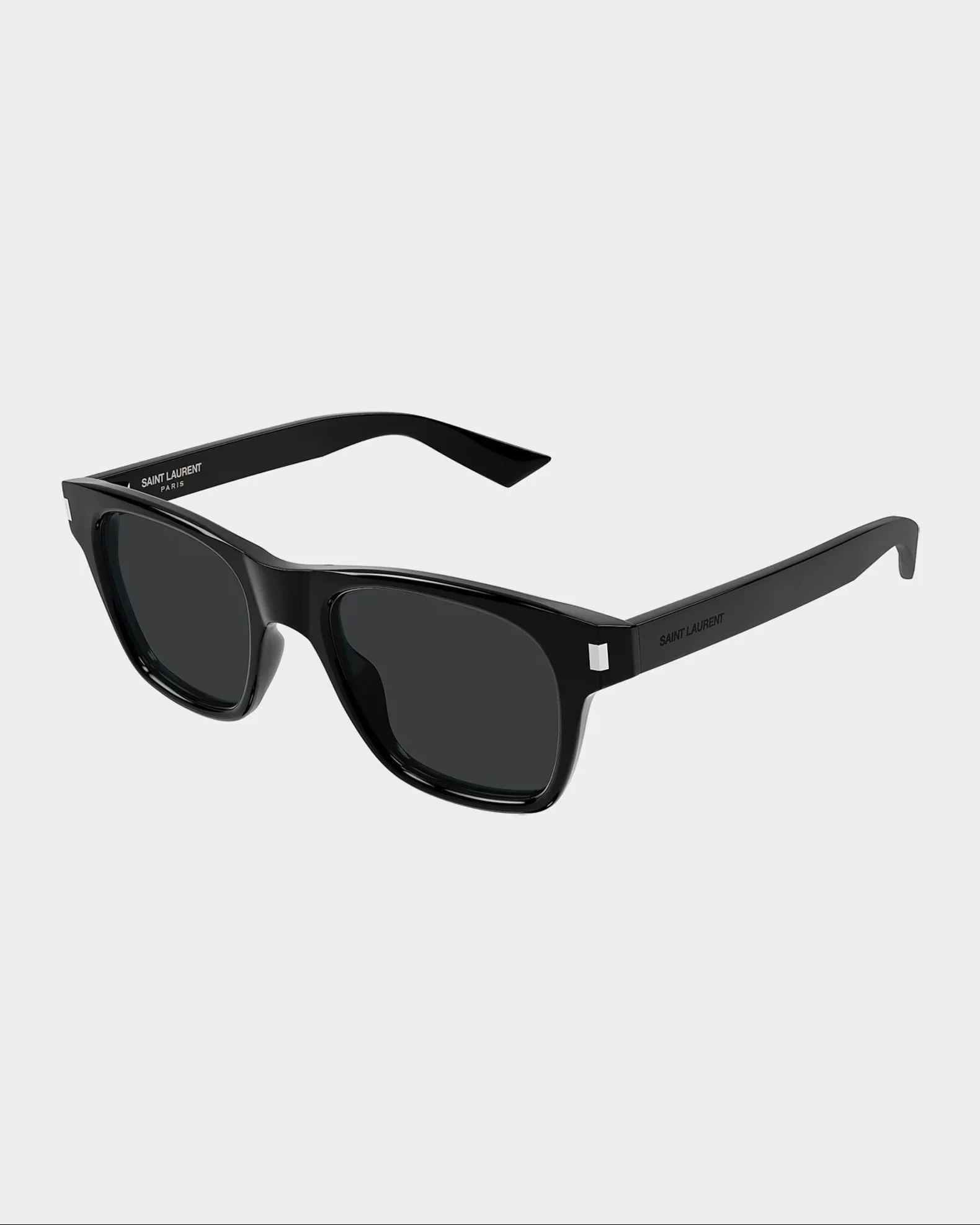 A pair of black Saint Laurent sunglasses with dark lenses on a light grey background.