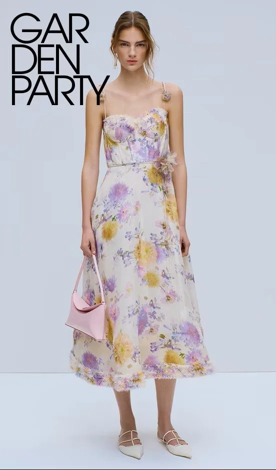 A young woman wearing a floral dress holding a pink handbag, standing against a plain background with the words 'GARDEN PARTY' written in black at the top left corner.