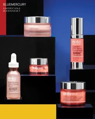 Collection of skincare products including a dropper bottle, a jar, a pump bottle, and a tube, all labeled M-61 VitalTest C and other skincare formulations, displayed against a black and blue background.