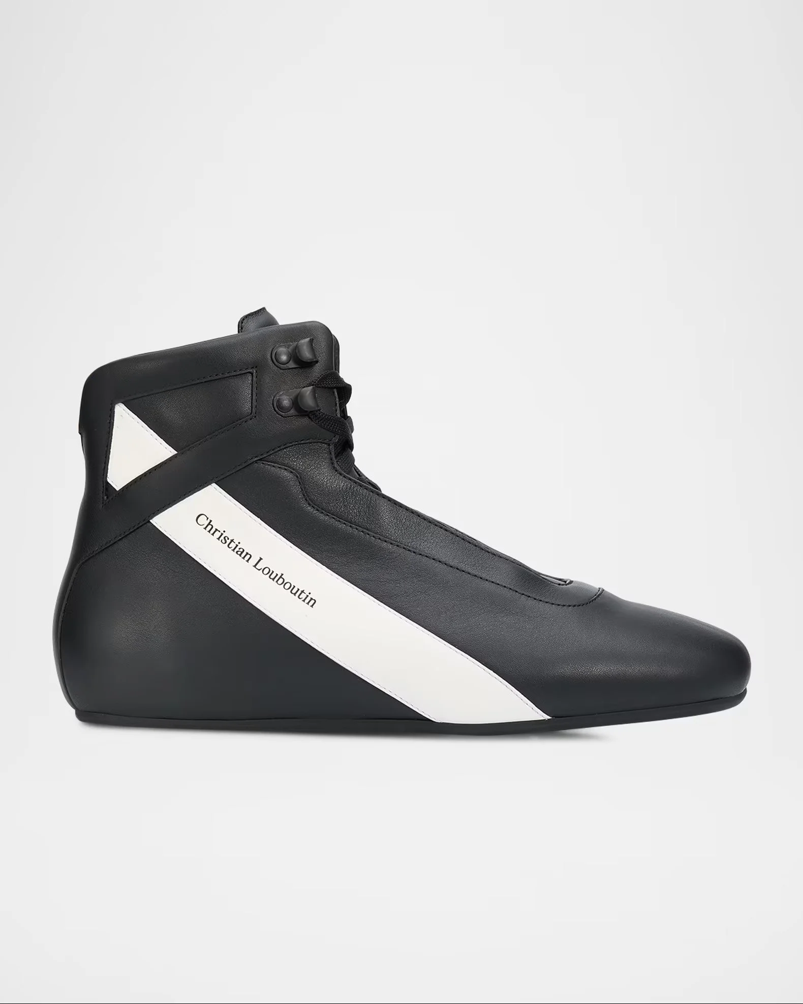 Black and white sneaker with the words Christian Louboutin written on a white stripe on the side, set against a plain background.