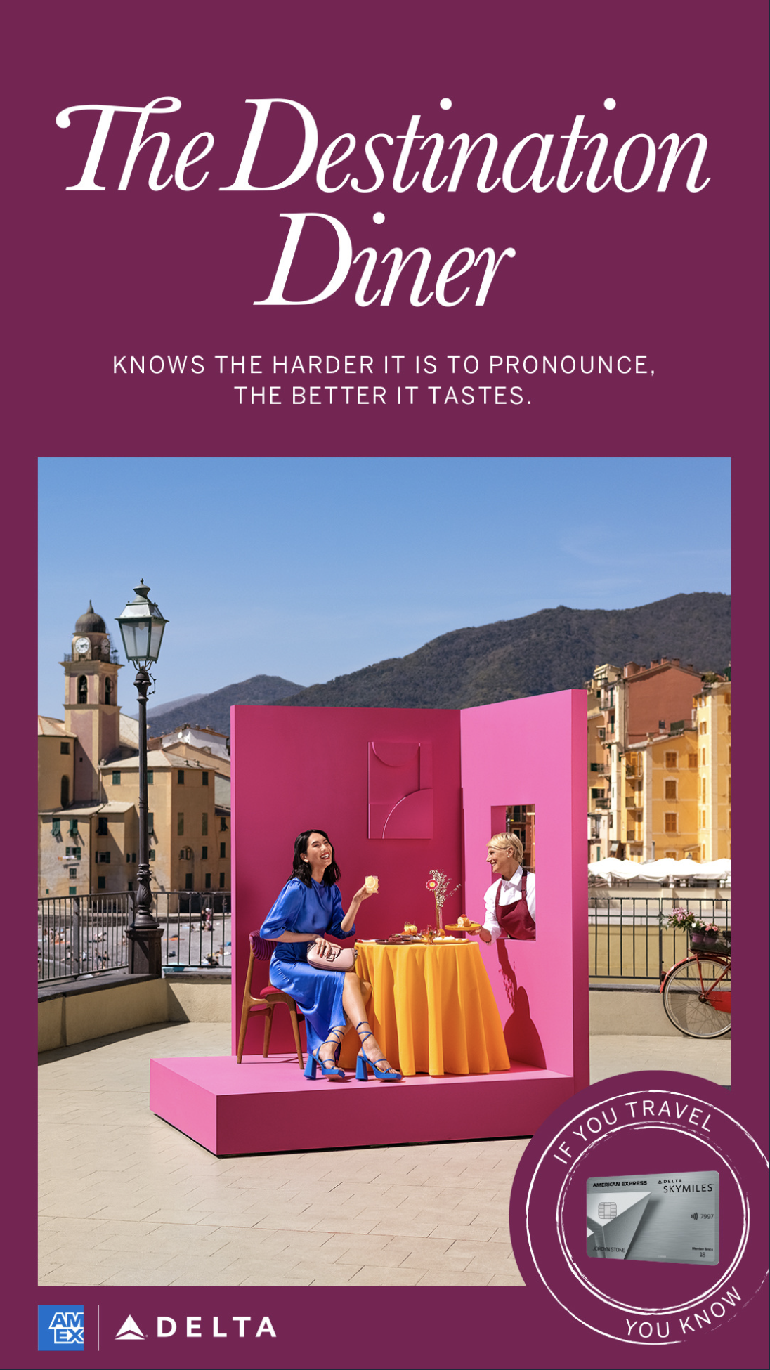 A promotional poster for The Destination Diner featuring a colorful outdoor setup with two women dining at a pink and yellow table, set against a scenic mountain town background.