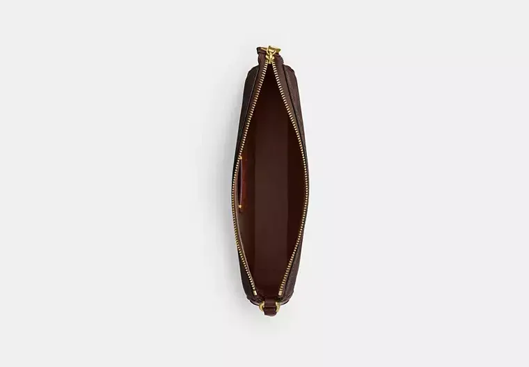 Open brown leather bag with gold zipper showing empty interior.