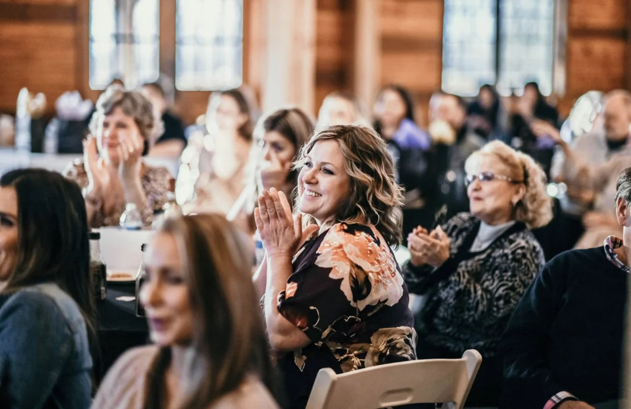 Audience members listening during the Igniting Hope Summit hosted by Jess Patz