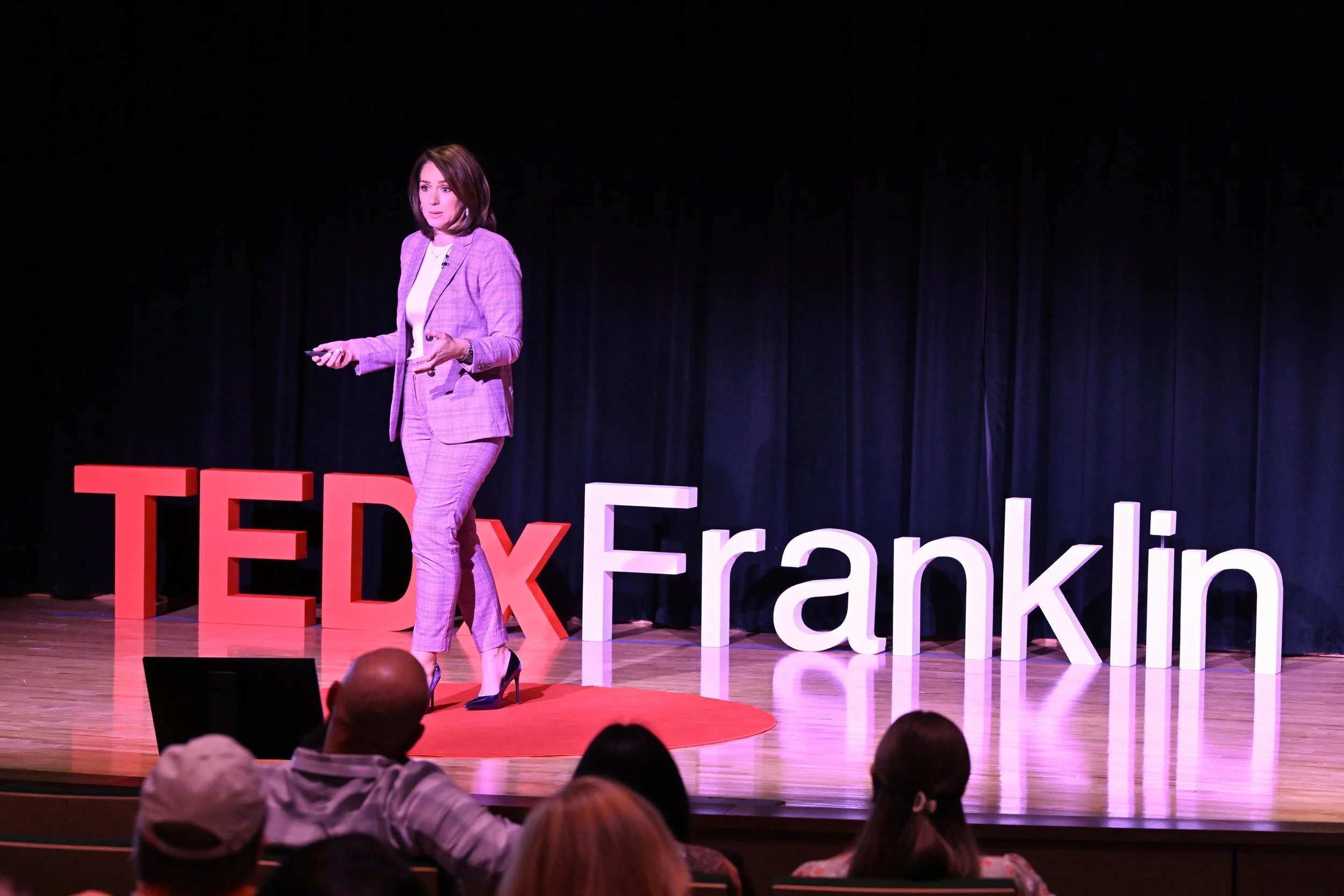 Jess Patz on stage at TEDxFranklin in March 2026