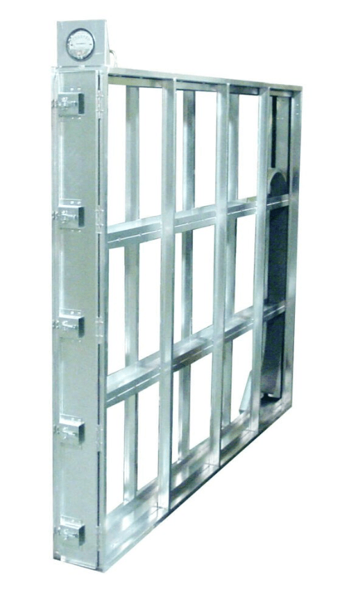 Metal framework of a large industrial oven door with a built-in thermometer and locking mechanism.