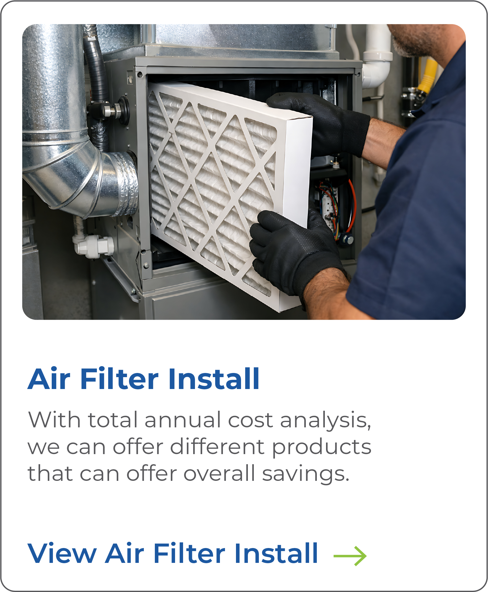 Technician installing an air filter into HVAC unit, wearing black gloves and navy blue work uniform.