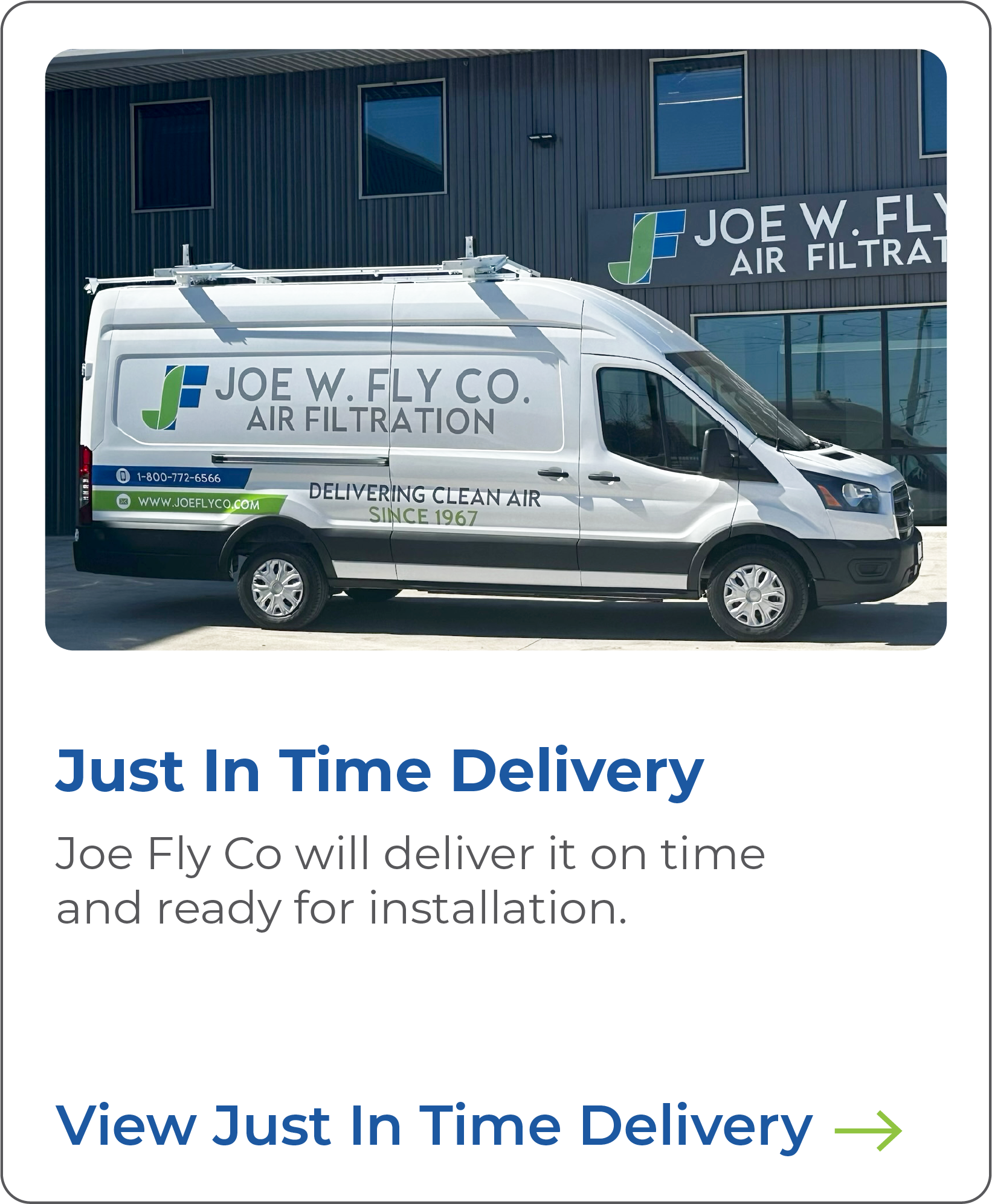 White van with company logo and contact information parked outside a building with a sign that reads "Joe W. Fly Co. Air Filtration."