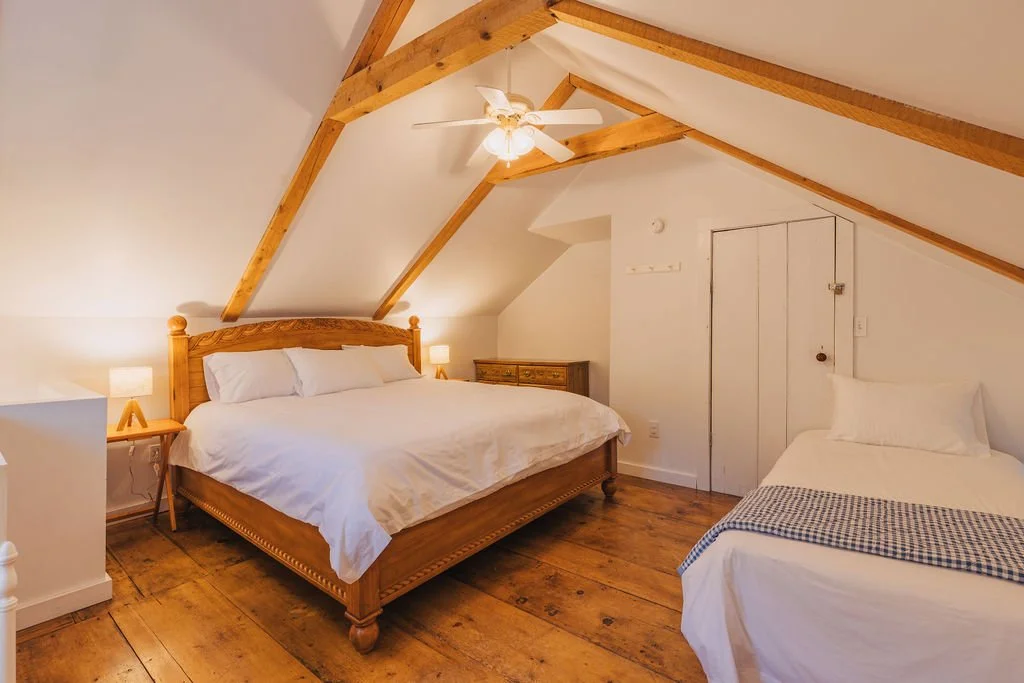 Bed with linens inside Hartwick House