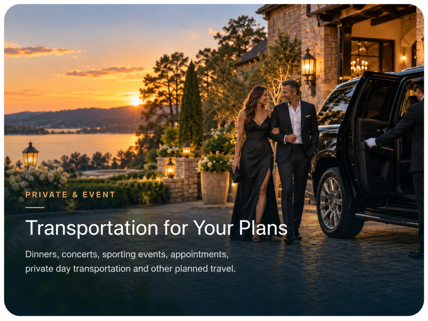 A couple in formal attire walking outdoors during sunset, with a black luxury vehicle and a valet attendant nearby, at an elegant venue with garden and water view.