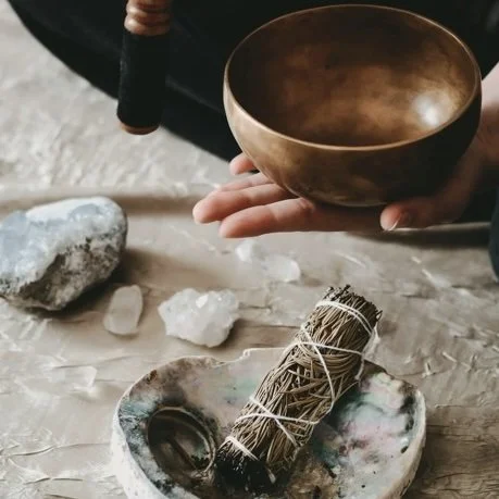 Singing bowl and sage, representing the Space Healing Process