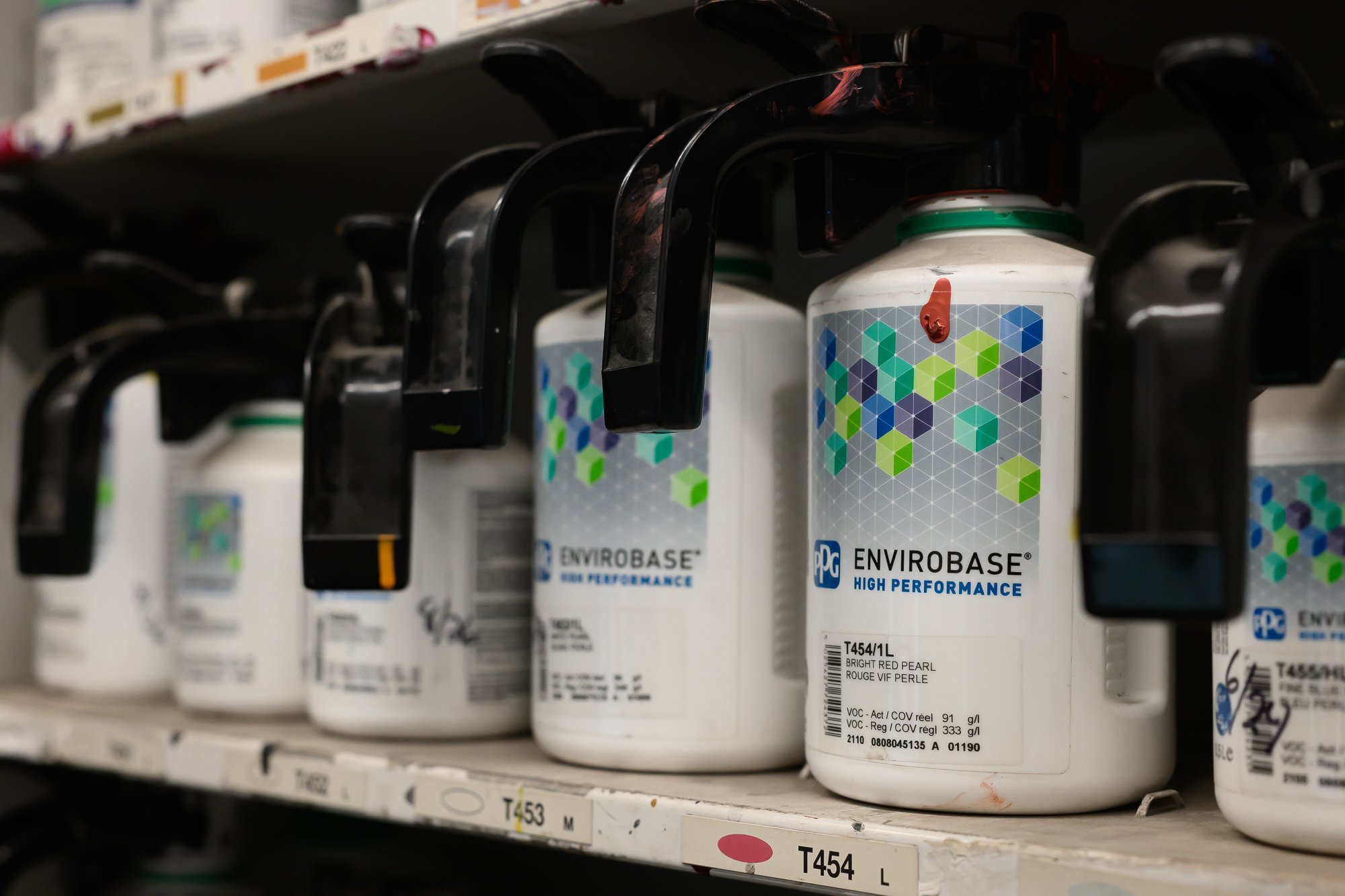 Shelf of automotive paint in the Delarm's paint room