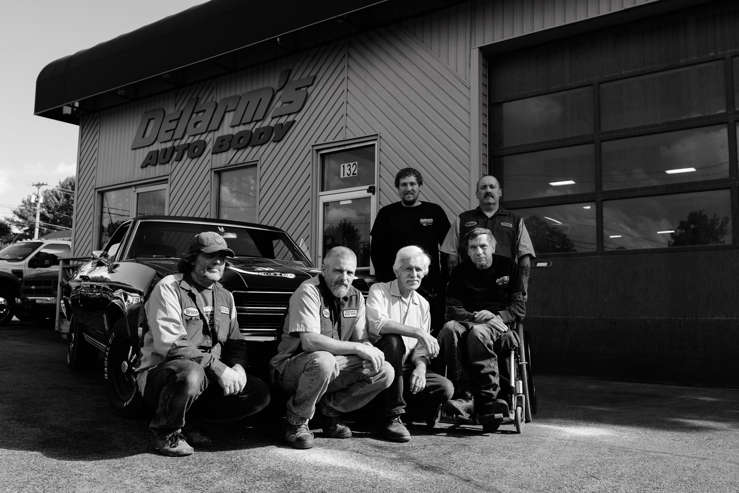 The Delarm's Auto team outside the shop on East Market Street