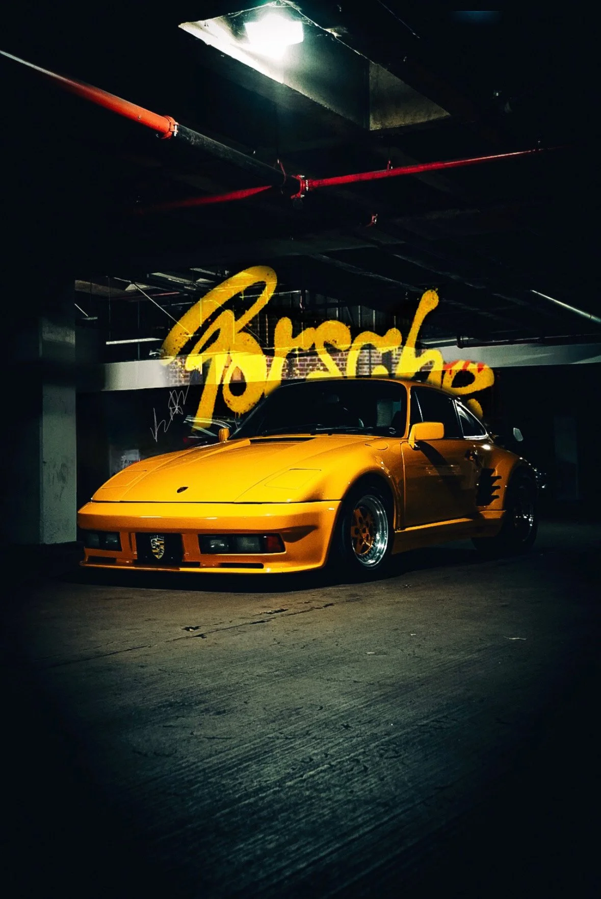 A yellow vintage sports car parked in a dark underground garage with a neon sign that says 'paradise' in the background.