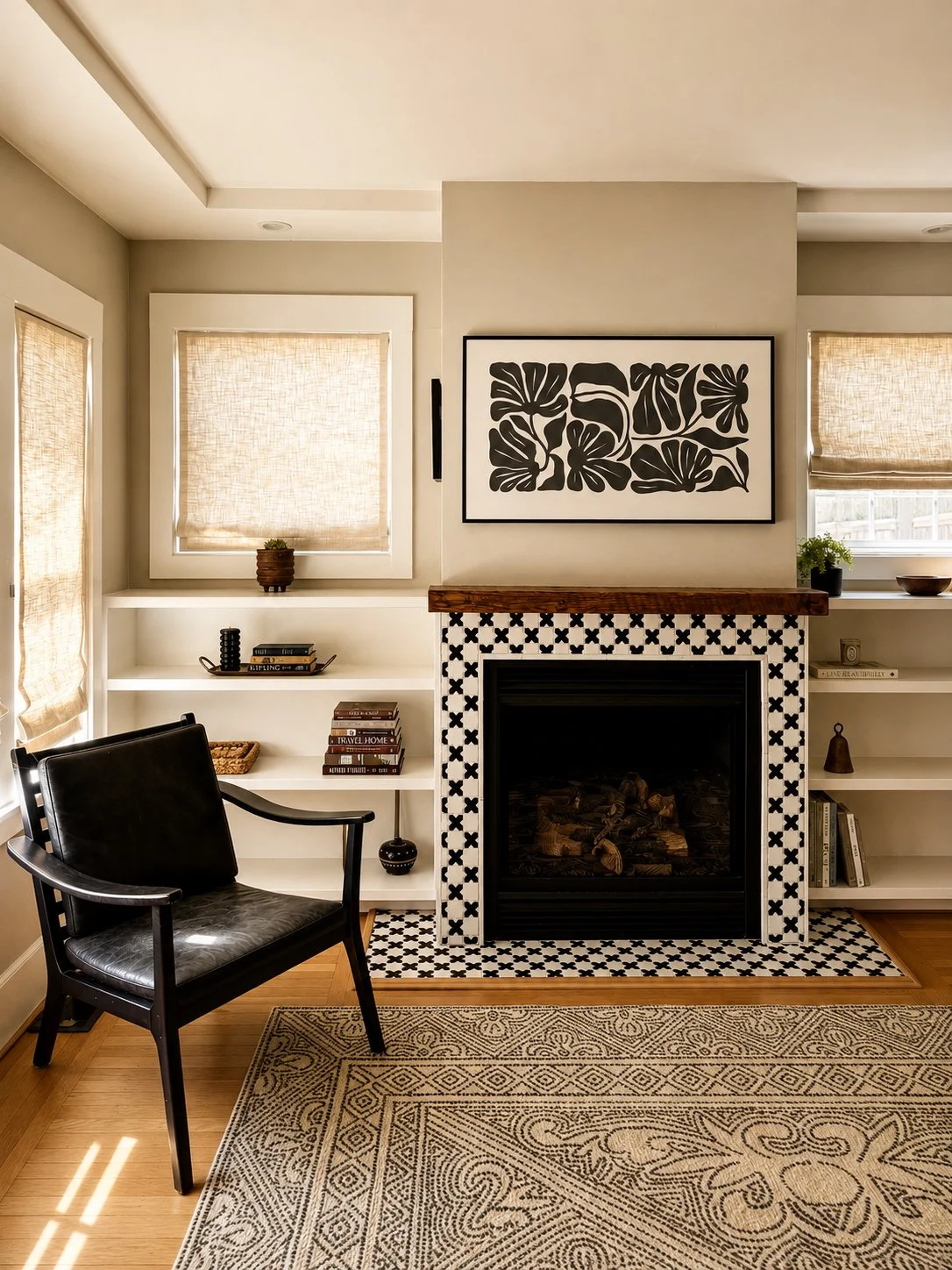 Warm and stylish living room by Aster & Aire featuring a patterned tile fireplace, custom interior styling, woven Roman shades and layered natural textures, showcasing approachable interior design in San Anselmo, Marin County.