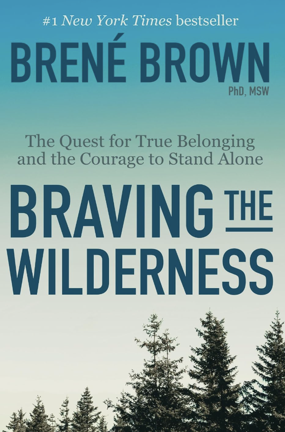 Book cover titled "Braving the Wilderness" by Brené Brown with a background of pine trees against a gradient sky.
