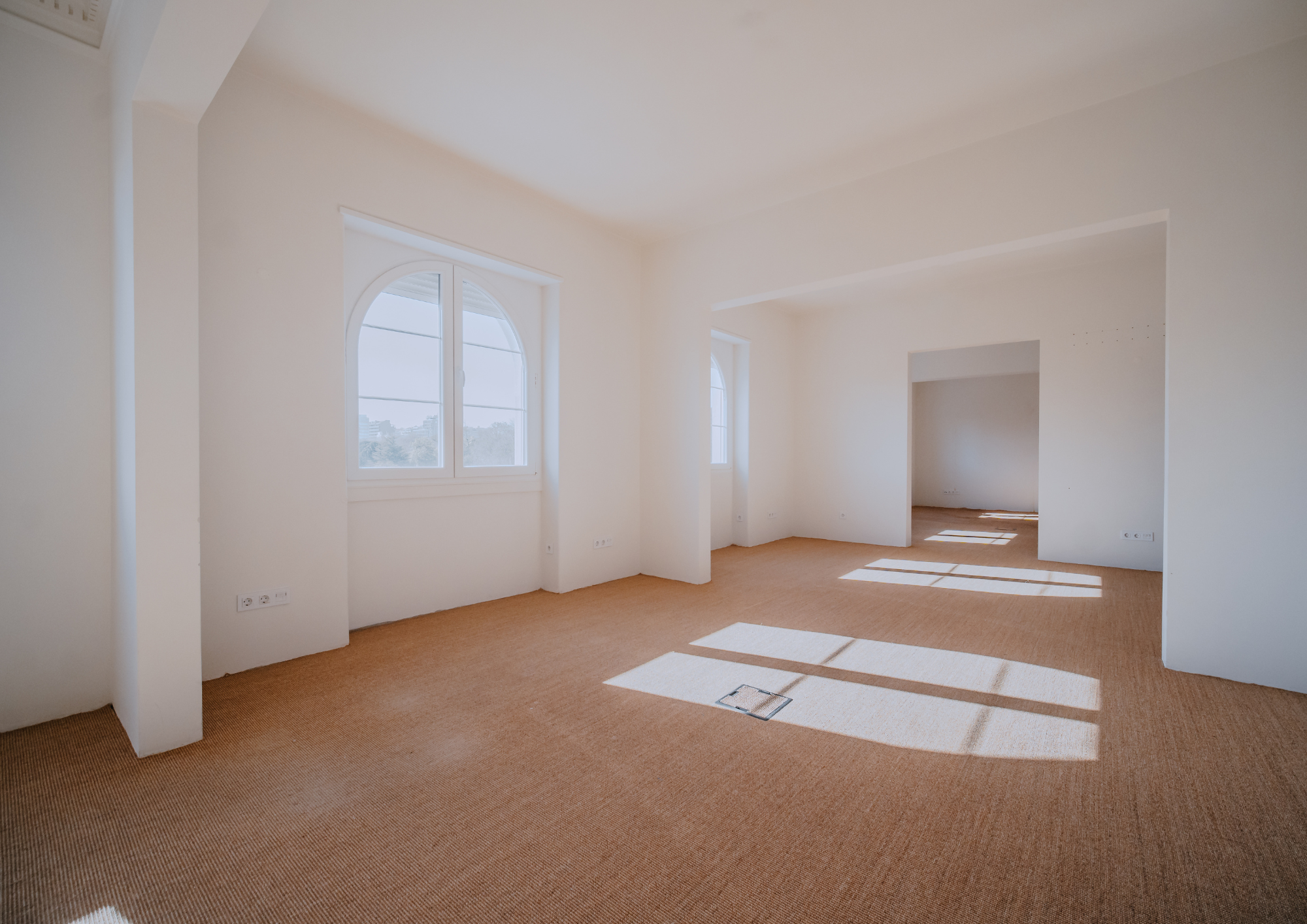 Natural light and aligned openings emphasise scale, rhythm and spatial continuity.